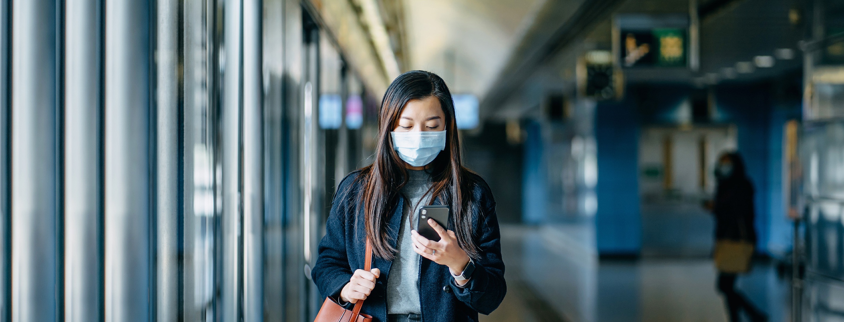 Person taking protective health messages while traveling