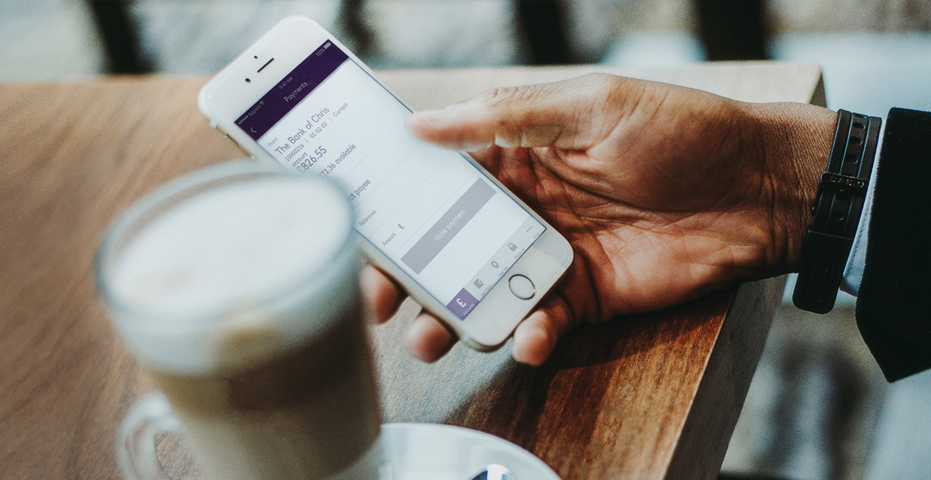 Person holding a mobile device with the NatWest app